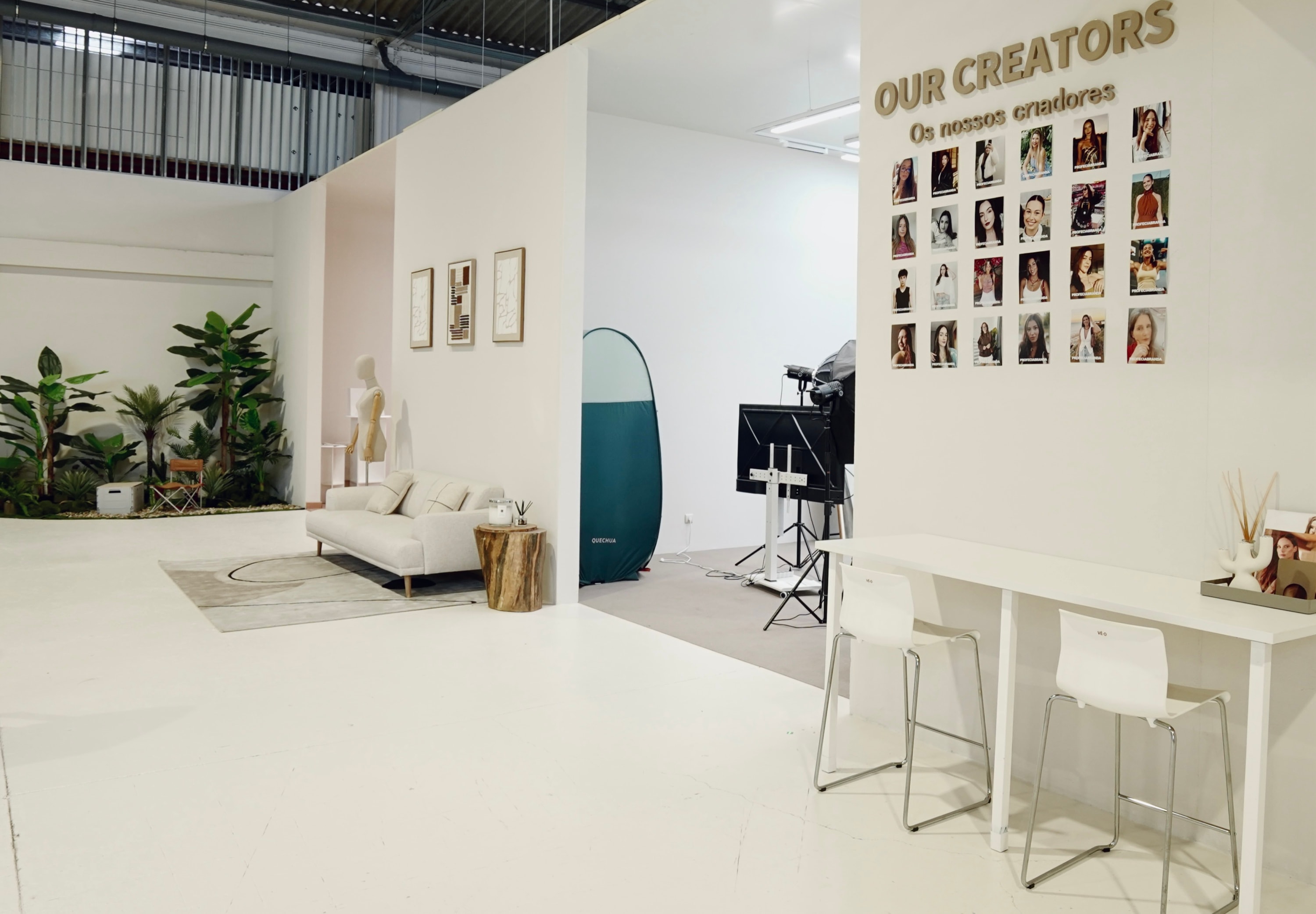 PROFECIABRAND studio lounge with the "Our Creators" wall — a grid of portraits of the creators in the network